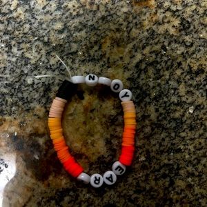 Selling a gradient peach bracelet and I can replace the name with yourname Js dm